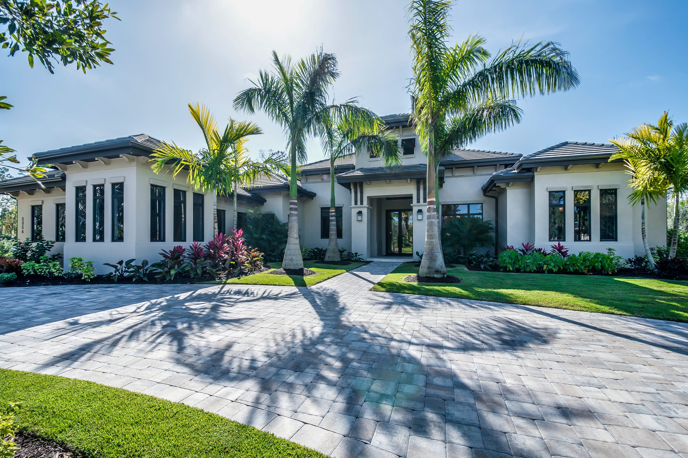 Beautiful Florida home with palm trees — pressure washing by White Glove Exteriors